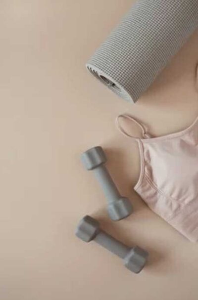 Dumbbells and sports bra