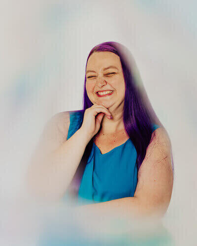 Wedding Marketing Strategist Heidi Thompson smiling and holding back a laugh