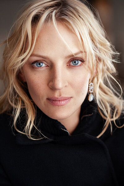 Elegant portrait of Uma Thurman by Ylva Erevall in a studio setting.