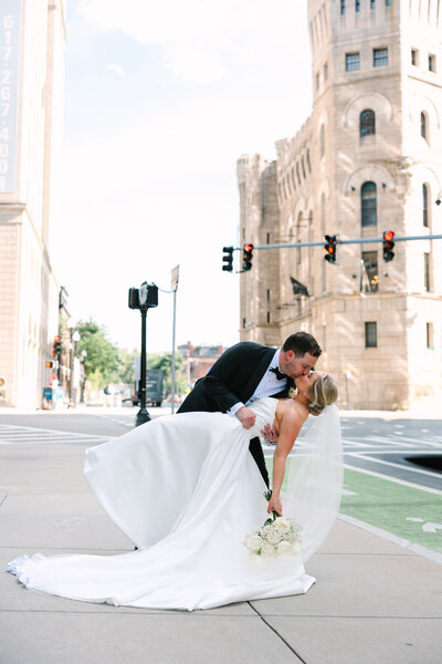 close up of wedding dress and silver bridal shoes