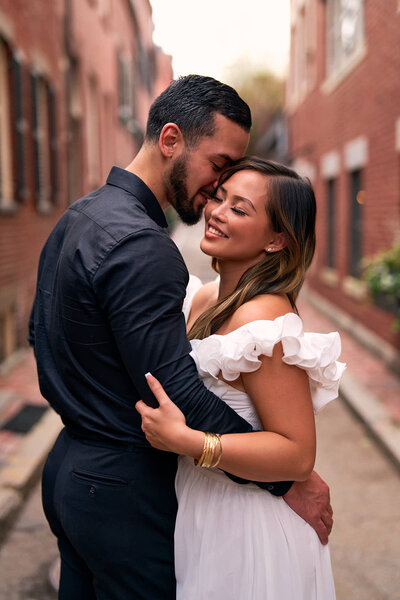 A man and a woman romantically holding 