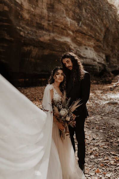 bride and groom embracing for portraits