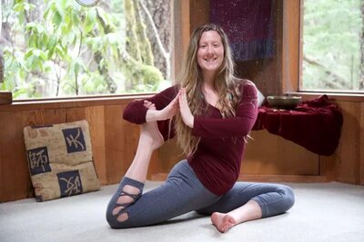 Student practicing mermaid pose during therapeutic yoga teacher training California