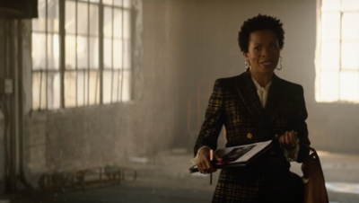 woman on a tv show playing business woman
