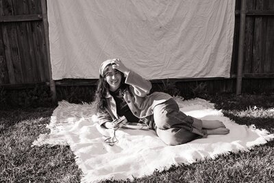 photographer portait session laying on a blanket