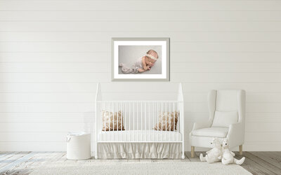 A beautiful framed portrait of  a newborn baby hangs in a South Bend home.