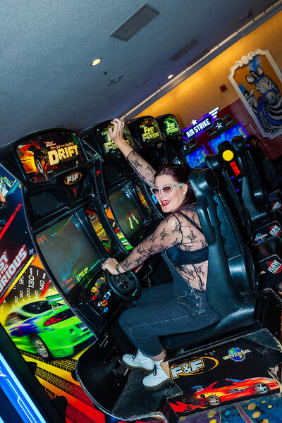 heather taylor of taylor made photography playing arcade game