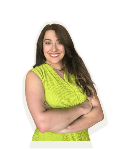 Madison, founder of Pop + Pixel Studio, smiling and crossing her arms.