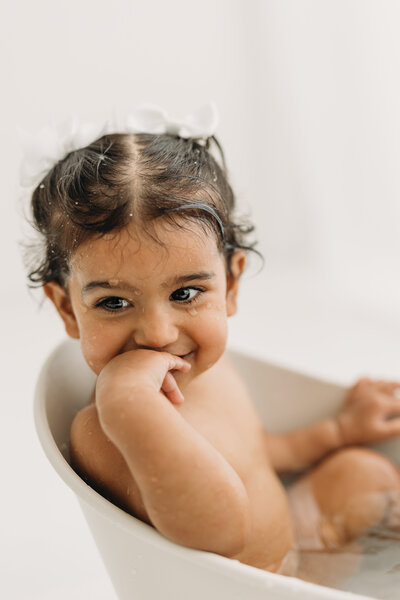 Cute baby with long eyelashes sleeping on a pillow