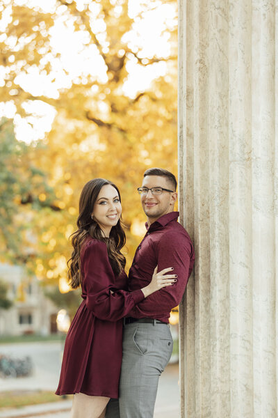 Princeton University | Couple posing for engagement photo among yellow fall trees | New Jersey