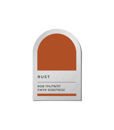 A rust orange color swatch, representing a wedding design in the event planning portfolio of Birdie June. 