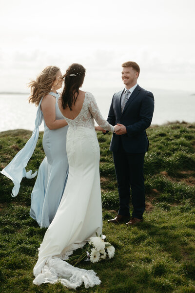 Eloping Ideas | Elopement ceremony where groom has a huge smile on his face, holding hands with his bride