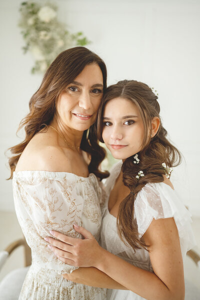 Mom and daughter looking in the camera