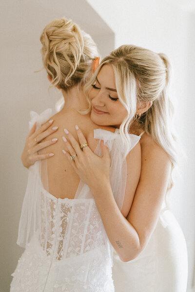 Bride styled with an elegant high bun and soft glam makeup — timeless wedding day look by Klover Beauty in Maryland.