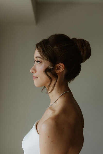 Elegant bridal portrait at the Hyatt Regency Lisle near Chicago, Illinois, captured by Rainstorm Photo & Video with soft natural light and a refined, documentary style.