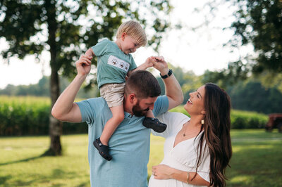 family of three candid laughing portrait outdoor session in chattanooga