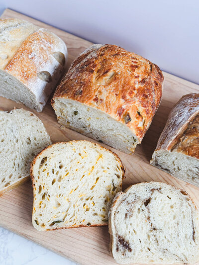 Trio of signature breads: Original, Jalapeno Cheddar, and Cinnamon Swirl available at next bread drop.