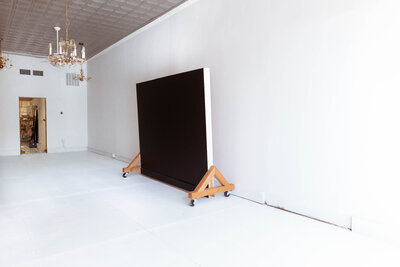 Double-sided 8x8 rolling backdrop with colorful paint options for content creation