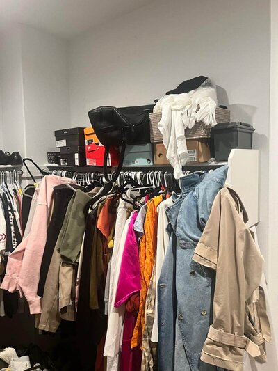 Messy, disorganized closet before Shaniece has worked on it.