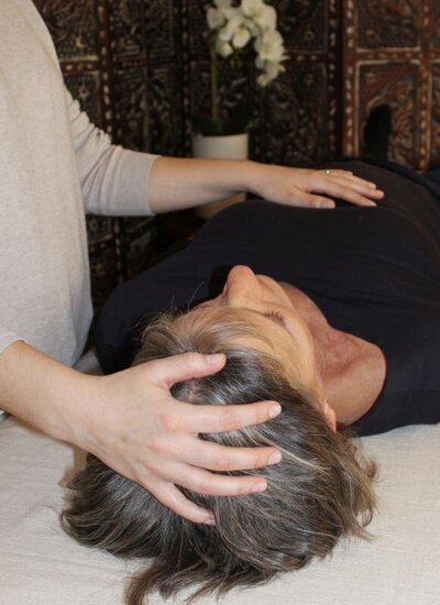 close up photo of a craniosacral treatmen of the jaw