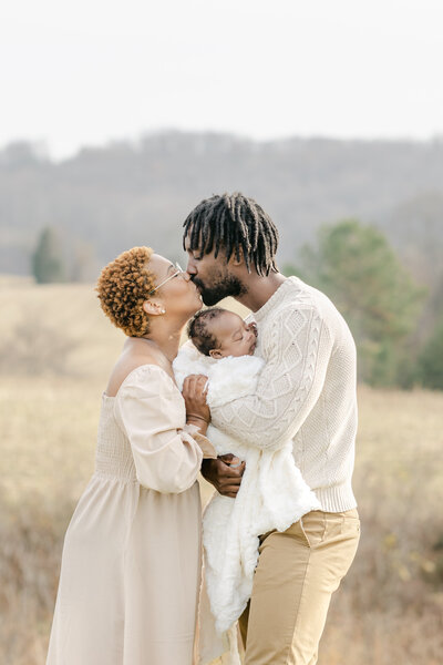 Couple and their sweet dog with Winston-Salem family photographer