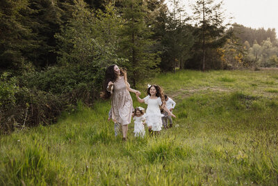 Children laughing and playing during a candid family photo session in Los Angeles, capturing joyful and natural moments.