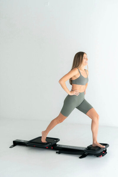 kylie smiling lunging on reformer