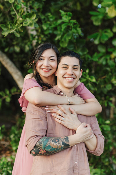 girl hugging man from behind