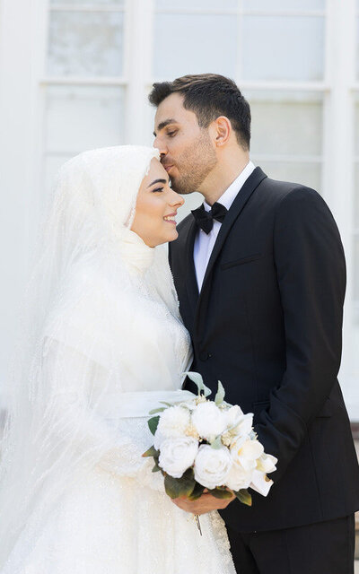 Traditional American Arabic wedding in St Augustine FL, bride and groom embracing each other