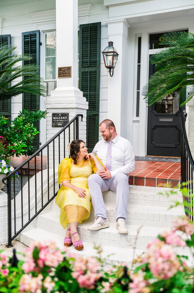 Bride and groom laughing at each other