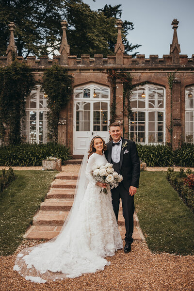 bride and groom pose together