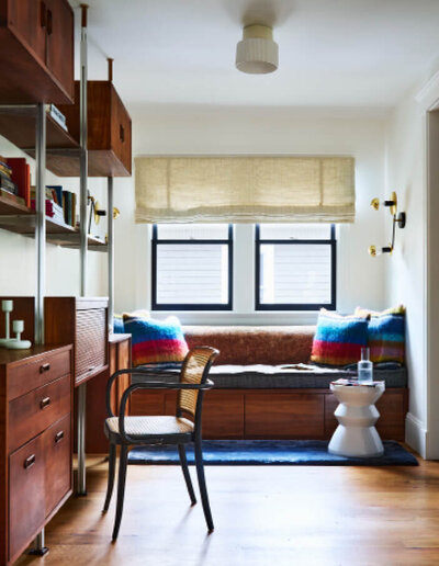 Boston interior decorator mixed vintage pieces with new built-ins and Pierre Frey fabrics at a Brookline renovation project, creating a layered, timeless look.
