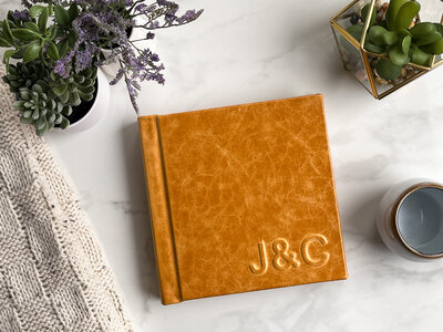 Whiskey colored, leather covered wedding album