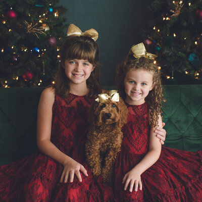 sisters celebrating christmas in pastel winter wonderland