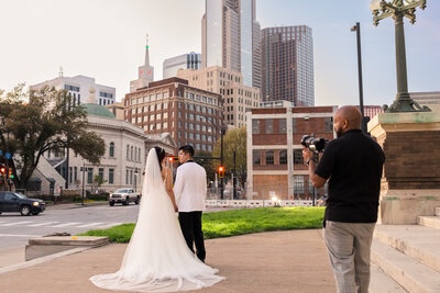 An Award winning Dallas based videographer filming couple in downtown Dallas