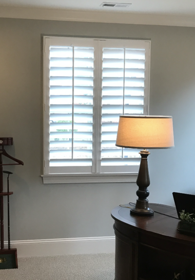 Plantation shutters in a home office setup