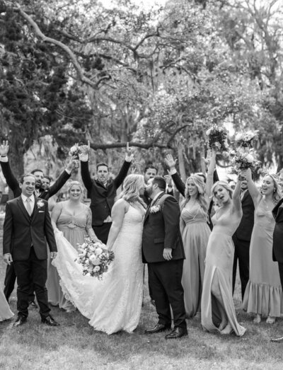 black and white photo of bride and groom kissing at fountain of youth wedding in st. augustine