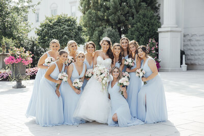The Palace at Somerset Park | Bride with bridesmaids on patio during summer wedding | Somerset, New Jersey