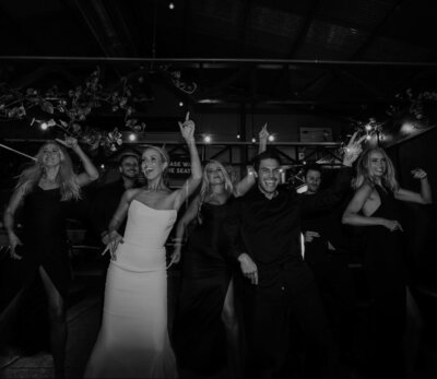 Energetic bridal party dance, exemplifying LIMCO’s vibrant and inclusive approach to wedding celebrations.