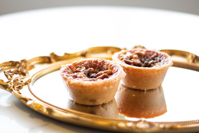 Close-up of a buttery pastry tart filled with caramelized sugar and nuts at Gold Leaf Pastries in Kamloops BC.