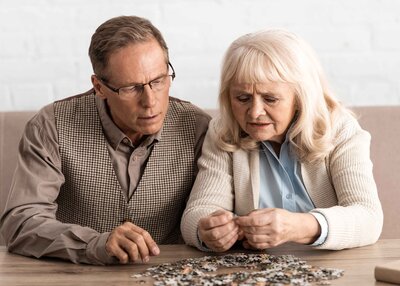 Old couple working on a puzzle
