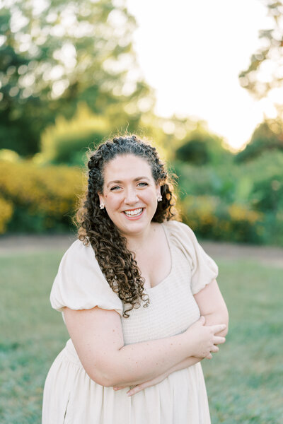 Fine art Catholic wedding photographer Laura Schaefer with her children in front of blooming tree