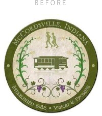 Outdated town seal for McCordsville with a trolly and grape vines in a cirlce badge