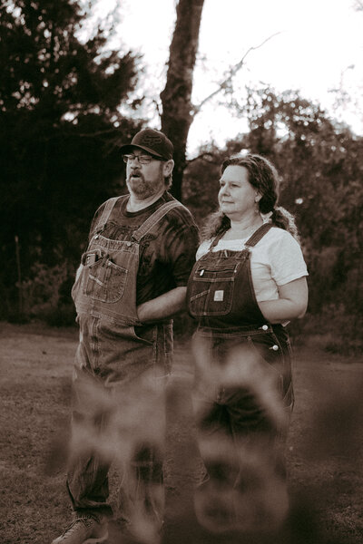 Couple standing looking over their garden