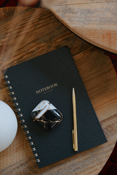 Brand photography flat lay of notebook and office details
