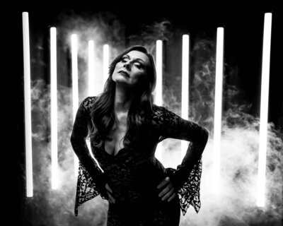 woman in a black dress with smoke effect