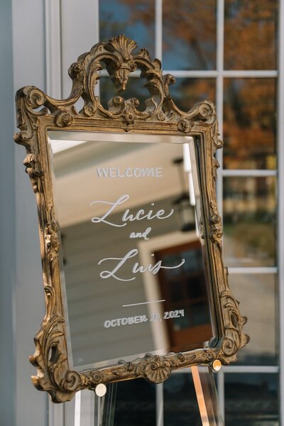 Gold mirror welcome sign with calligraphy for Westbrook, Connecticut wedding