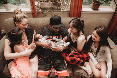 in home lifestyle newborn photo with twins and older siblings
