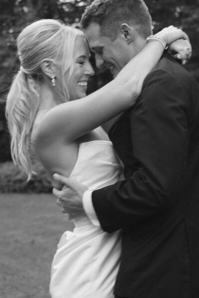 bride and groom kissing at engagement session