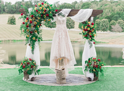 wedding dress hanging from pergola